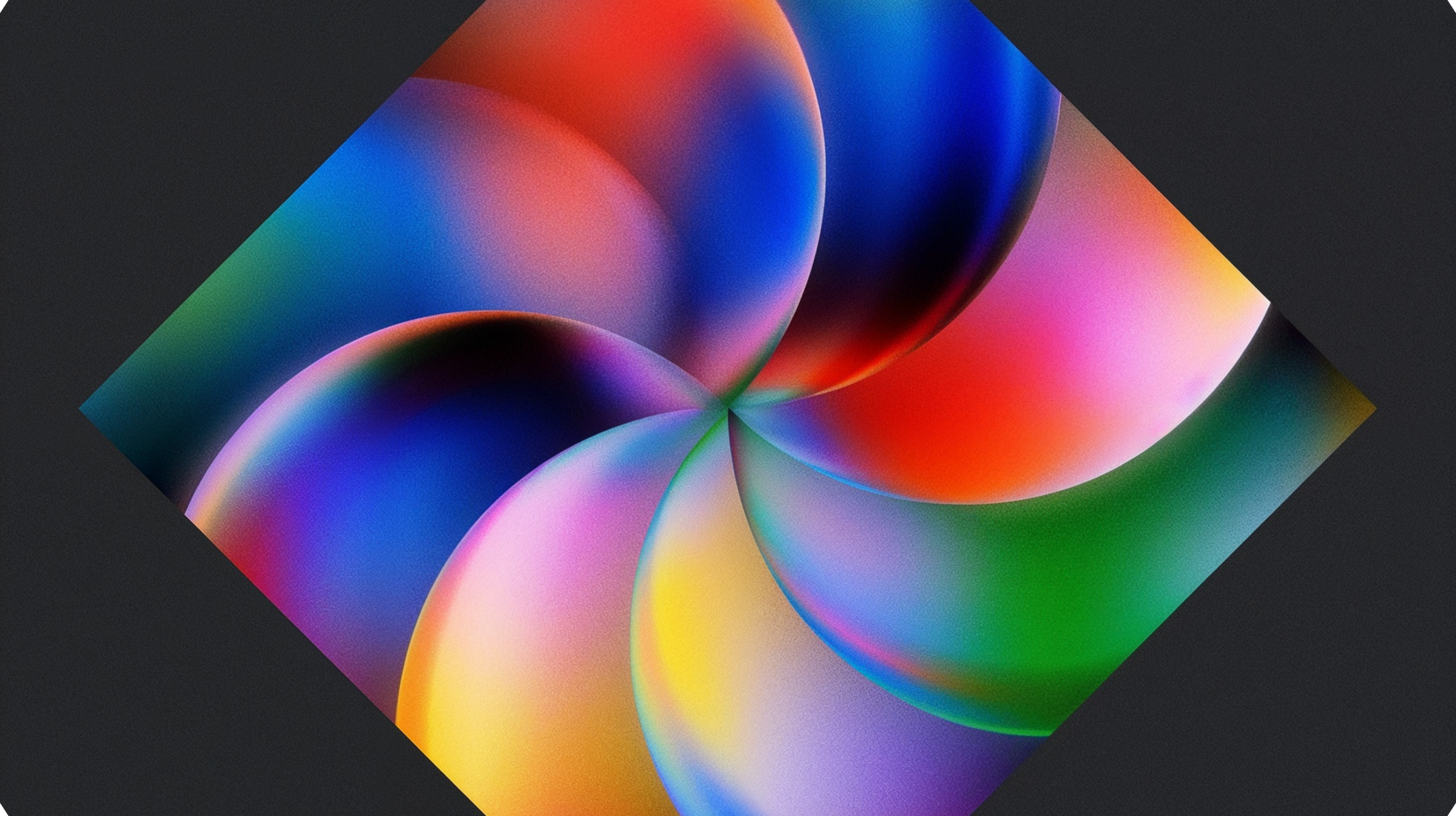 A colourful abstract graphic featuring swirling, overlapping gradients inside a diamond frame against a dark background.